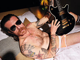 Eagles Of Death Metal frontman strips for interview