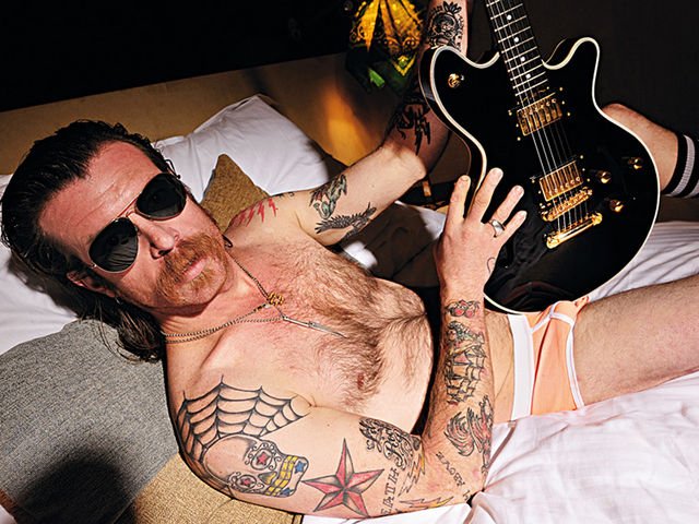 Jesse Hughes in bed with Total Guitar magazine (photograph: Jesse Wild)