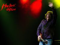 Gary Moore waves farewell at the conclusion of his set at the Montreux Jazz Festival in Montreux, Switzerland, July 2010