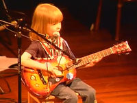 5-year-old plays Johnny Cash like a reasoned vet