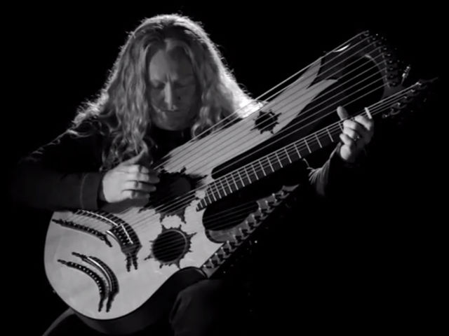 Who are those guitarists? Just one, actually - it's Keith Medley on his homemade 27-string model