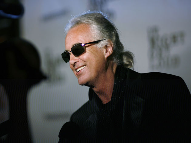 Jimmy Page arrives for a party, looking neither dazed nor confused