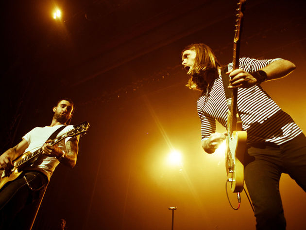 Singer-guitarist Adam Levine and lead guitarist Valentine share the spotlight, if not "The Sun"