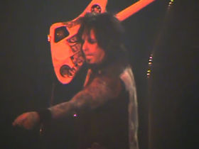 Motley Crue's Nikki Sixx spits at female fan