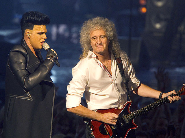 Lambert and May onstage at the MTV Europe Music Awards, November 2011
