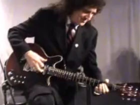 Brian May plays guitar solo during university visit