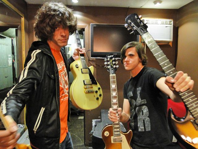 Gibson aficionados Josh Martin and Tony Smith show off the tools of their trade
