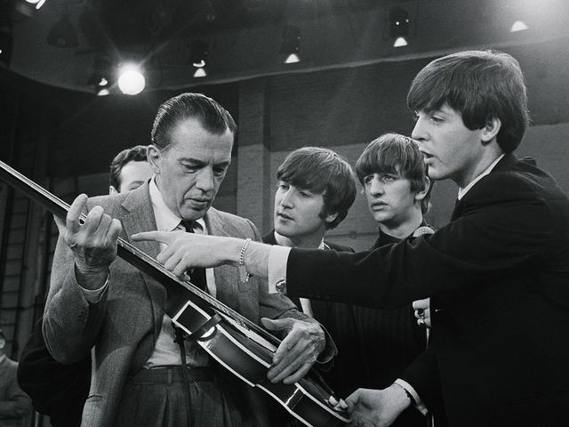 Paul gives Ed a free bass lesson