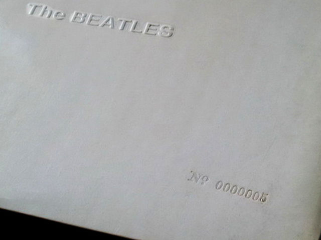 Embossed title, stamped serial number