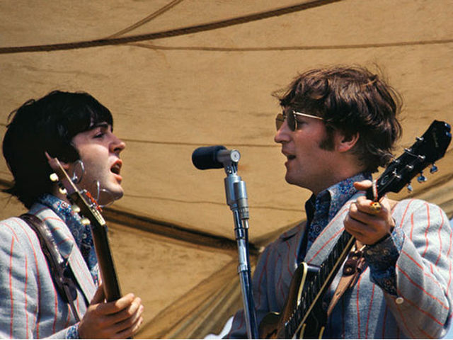 Paul and John share a mic in '66