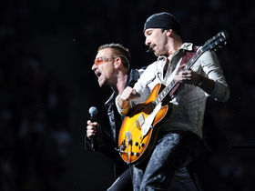 U2 reschedule tour dates, post video: "We're coming back"