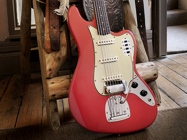 Fender Bass VI A wonderful Fiesta Red example in situ at Vintage And Rare Guitars in Bath, UK