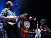 Win Butler on the mandolin and, in the background, bassist Tim Kingsbury