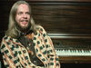 Who needs a cape when you've a jacket like that?! Wakeman at his piano in 1977