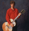 Caressing a Gibson J-200 in 1997.