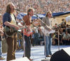 Crosby, Stills & Nash perform outdoors, 1982