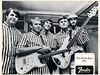 Al Jardine and Bruce Johnston sporting a Strat and Precision Bass respectively