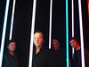 With his Simple Minds bandmates (far left)