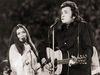Johnny Cash and wife June Carter performing at Mississippi Memorial Stadium, 1975