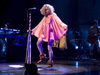 Believer Performing at the Casino de Paris in 2008, a becaped Alison channels her inner pixie.