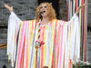 I Wanna Life Rainbow love-in chic or back door strip curtain? Alison happy and hippy at Glasto in 2008.
