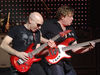 Joe Satriani (left) and Stu Hamm perform live