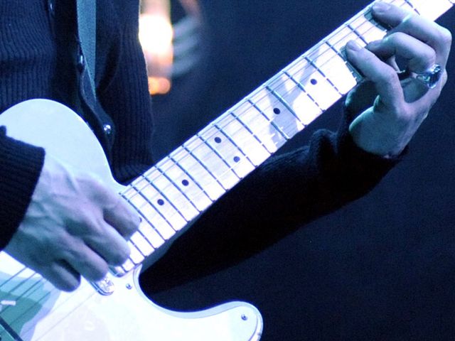 The lighting has the blues, but does this guitarist?