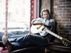 Bridges kicks back with a Gibson J-200