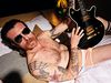 Jesse Hughes of Eagles Of Death Metal sporting shades... and not much else