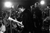 Jones onstage with the Pistols and customary white Les Paul Custom