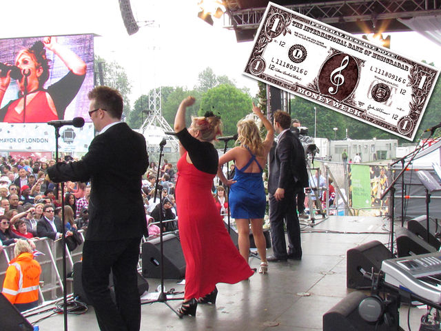 Sera (second left, video screen) rocks Hyde Park with MIB