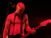 Tension Head A rather evil looking Nick Oliveri on-stage with QOTSA in 2003.