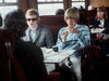 Stones producer/manager Andrew Loog Oldham and Brian Jones travel by train