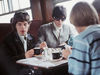 Jagger and Richards sit opposite Oldham and Jones