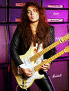 Doubleneck guitar? Amps set to 11? Naturally...