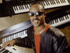Stevie and backdrop of synths cira 1980