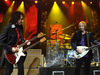 Mike Campbell and Petty show off their fancy guitars, 2010