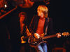 Petty rocks out with a Dan Armstrong guitar, 1980