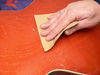 Sanding the guitar's rear blank
