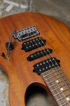 All In The Grain The beautiful grain of the Honduras mahogany ripples through the guitar's pristine satin finish, while hardware comprises a standard Gotoh bridge design with added Tremol-No trem-locking system, plus a H-S-H Suhr pickup arrangement.