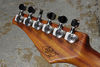 Signature Sounds Guthrie's signature adorns the back of the headstock, which is equipped with Gotoh locking tuners.