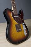 The Acoustasonic Telecaster generates its acoustic sounds via a transducer pickup underneath a compensated rosewood bridge and Fishman Aura preamp, while a Custom Shop Twisted Tele single-coil provides classic electric tones in the neck.