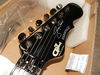 Notice the 'black chrome' tuning pegs and hardware. It's also got JC's rather fetching scrawl on the headstock.