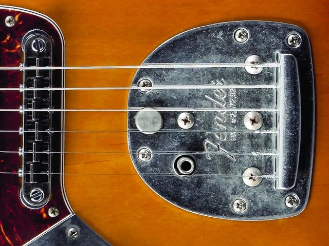 Bridge and Tailpiece Featuring a black chrome Gotoh bridge and a functioning vibrato (vibrato arm not pictured).